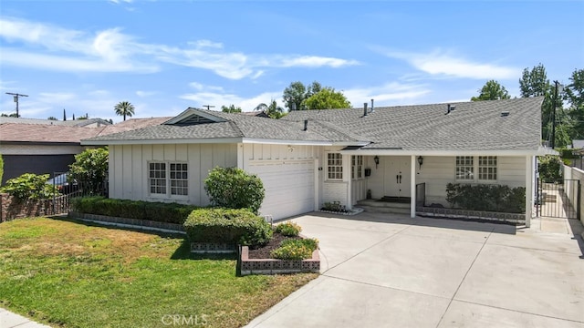 6130 Longridge Ave, Valley Glen, CA 91401 - ranch-style house featuring driveway, board and batten siding, a garage, and a shingled roof