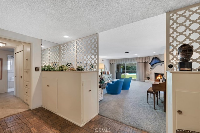 6130 Longridge Ave, Valley Glen, CA 91401 - kitchen featuring carpet flooring, a textured ceiling, and a fireplace