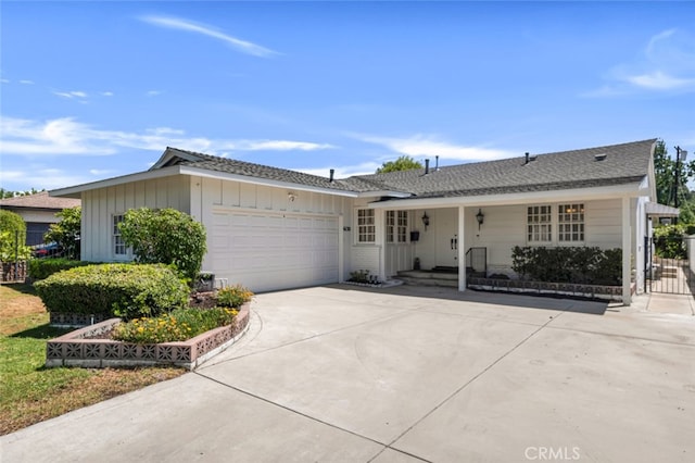6130 Longridge Ave, Valley Glen, CA 91401 - ranch-style home featuring an attached garage, driveway, and board and batten siding