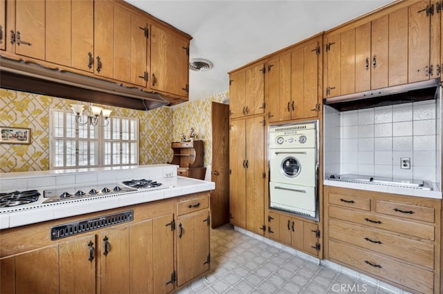 6130 Longridge Ave, Valley Glen, CA 91401 - kitchen with a warming drawer, oven, black electric stovetop, tasteful backsplash, and under cabinet range hood