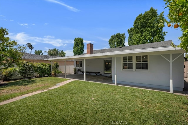 6130 Longridge Ave, Valley Glen, CA 91401 - rear view of property featuring a chimney, a patio area, and stucco siding