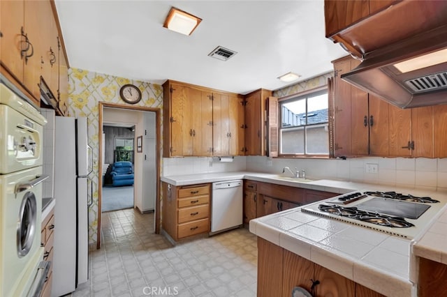 6130 Longridge Ave, Valley Glen, CA 91401 - kitchen with white appliances, wallpapered walls, ventilation hood, light flooring, and tile counters