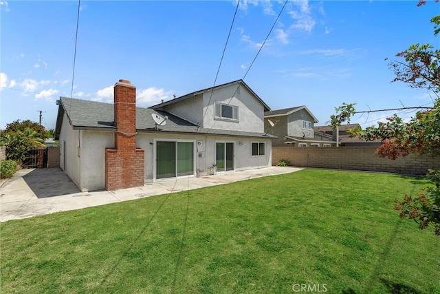 10172 Merrimac Dr, Huntington Beach, CA 92646 - rear view of house featuring stucco siding, a patio, and a chimney
