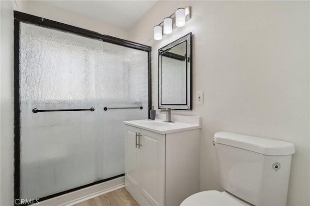 1304 N Devonshire Rd, Anaheim, CA 92801 - full bath with toilet, vanity, and wood finished floors