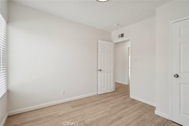 1304 N Devonshire Rd, Anaheim, CA 92801 - unfurnished bedroom with light wood-style floors and baseboards