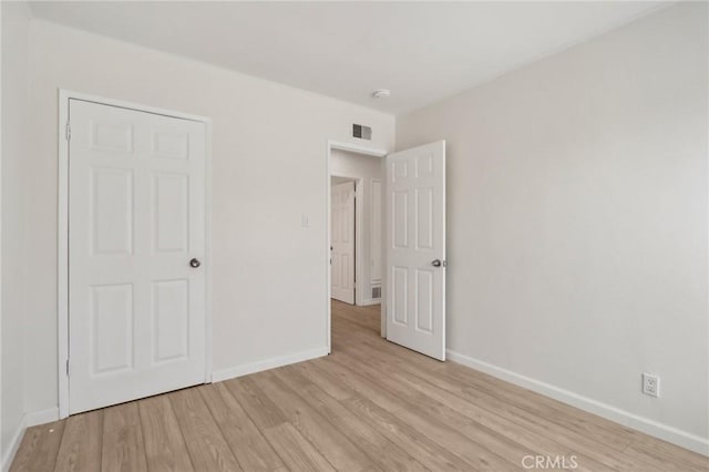 1304 N Devonshire Rd, Anaheim, CA 92801 - unfurnished bedroom featuring baseboards and light wood-type flooring