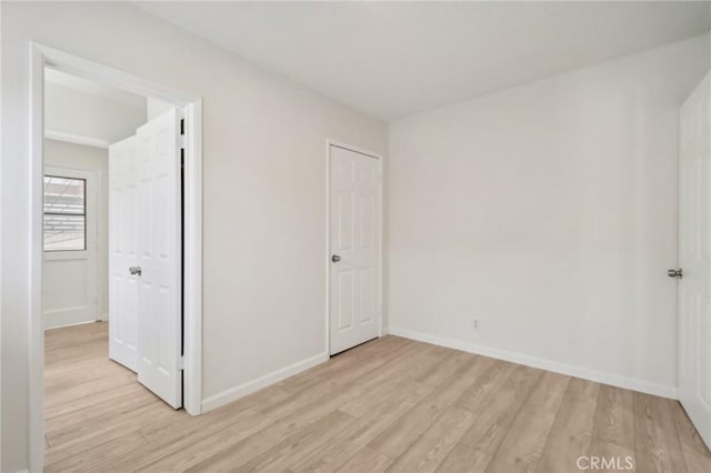1304 N Devonshire Rd, Anaheim, CA 92801 - unfurnished bedroom featuring light wood-style floors and baseboards