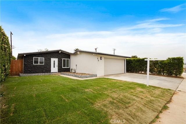 414 Markton St, Los Angeles, CA 90061 - view of front of home with a garage, driveway, stone siding, and stucco siding