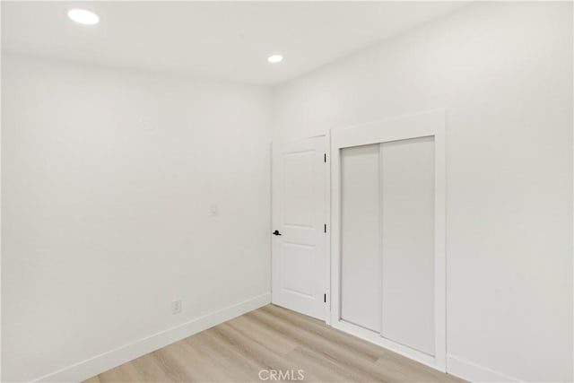 414 Markton St, Los Angeles, CA 90061 - unfurnished bedroom featuring light wood-style floors, baseboards, recessed lighting, and a closet