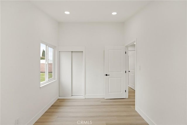 414 Markton St, Los Angeles, CA 90061 - unfurnished bedroom featuring baseboards, recessed lighting, light wood-style flooring, and a closet