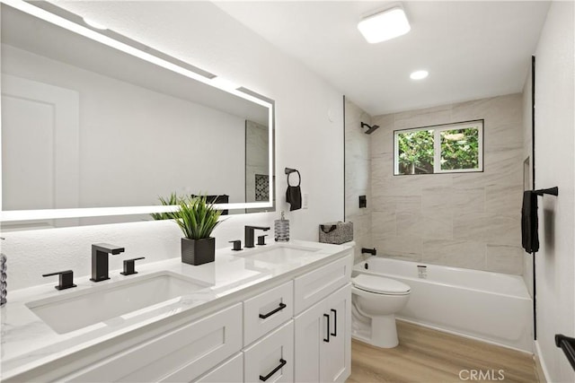 414 Markton St, Los Angeles, CA 90061 - bathroom featuring wood finished floors, double vanity, toilet, and bathtub / shower combination