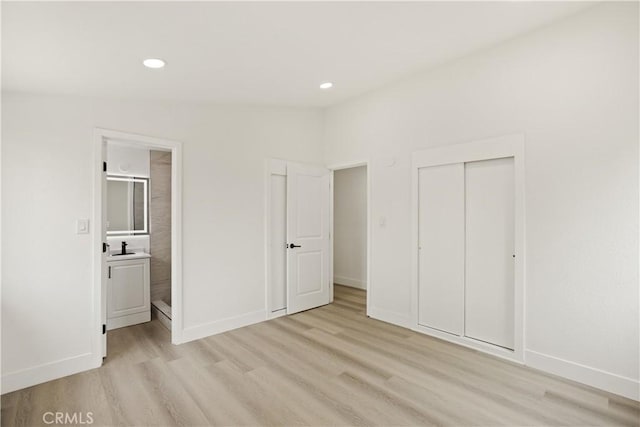 414 Markton St, Los Angeles, CA 90061 - unfurnished bedroom featuring light wood-type flooring, recessed lighting, baseboards, a closet, and a sink