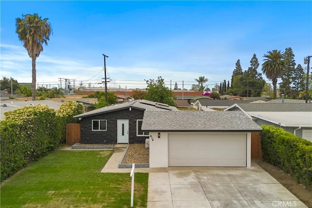 414 Markton St, Los Angeles, CA 90061 - view of front of home with stone siding, driveway, roof with shingles, and an attached garage