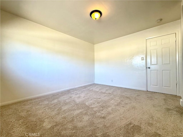 44037 Fern Ave, Lancaster, CA 93534 - carpeted empty room with baseboards and a smoke detector