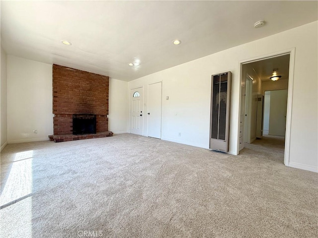 44037 Fern Ave, Lancaster, CA 93534 - unfurnished living room with carpet floors, baseboards, a brick fireplace, and recessed lighting