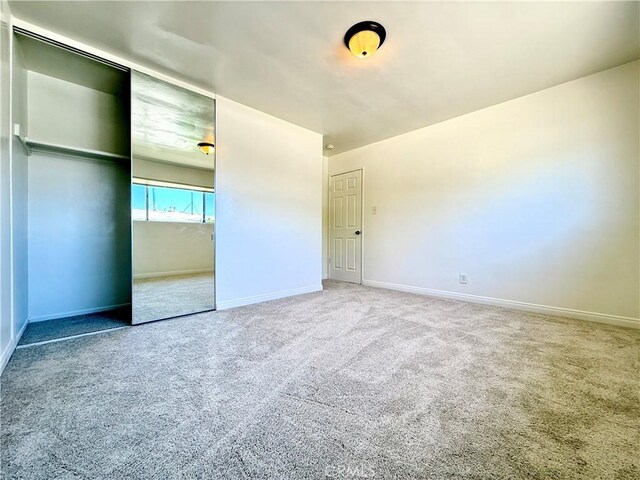44037 Fern Ave, Lancaster, CA 93534 - unfurnished bedroom featuring carpet, baseboards, and a closet