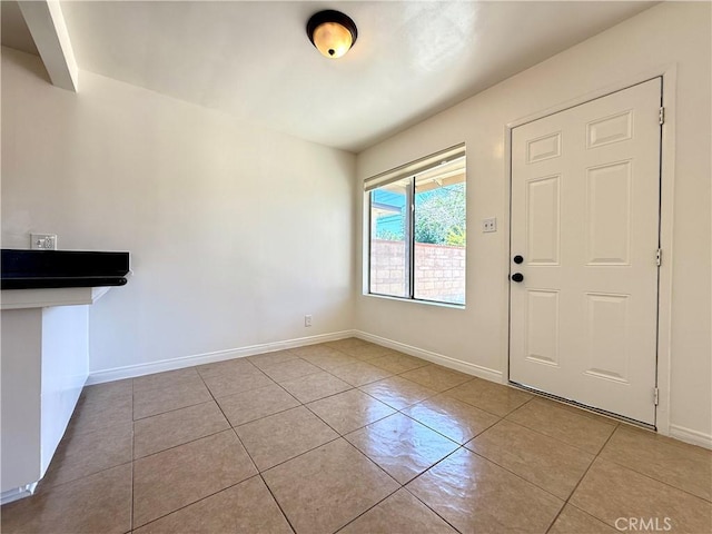 44037 Fern Ave, Lancaster, CA 93534 - unfurnished dining area featuring tile patterned flooring and baseboards