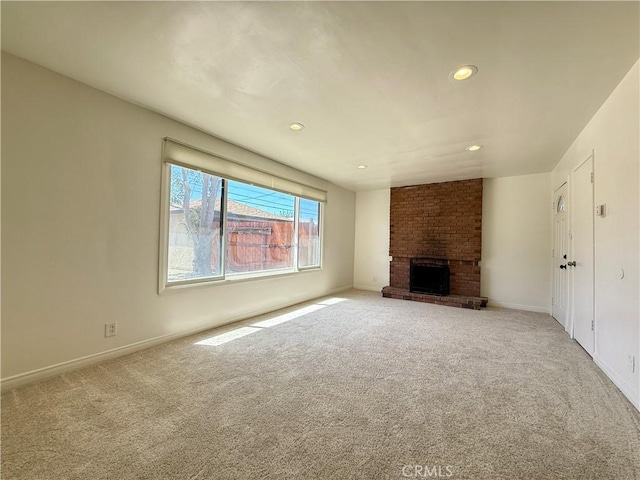 44037 Fern Ave, Lancaster, CA 93534 - unfurnished living room with carpet, recessed lighting, baseboards, and a brick fireplace