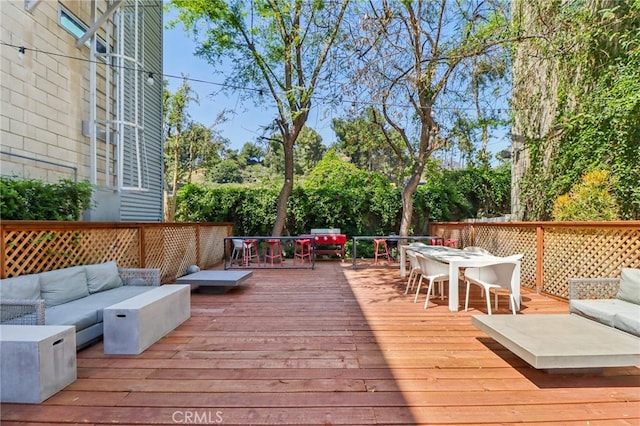 3450 Cahuenga Blvd W Unit 905, Los Angeles, CA 90068 - wooden deck with outdoor dining space and an outdoor hangout area