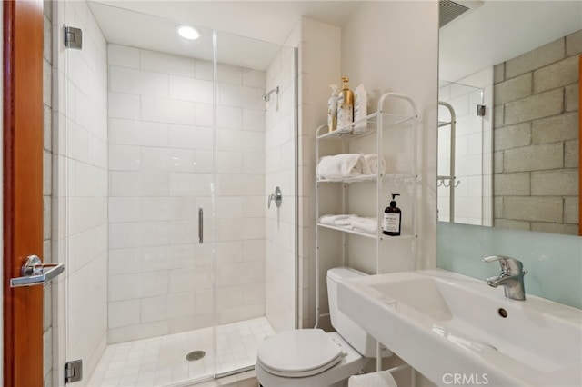 3450 Cahuenga Blvd W Unit 905, Los Angeles, CA 90068 - bathroom featuring a sink, a shower stall, and toilet