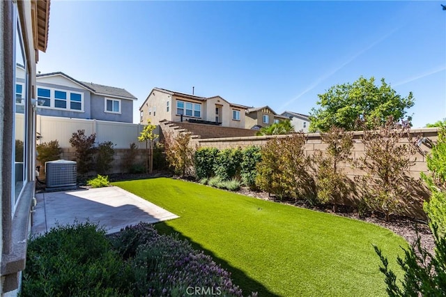 13139 Upland Ct, Hesperia, CA 92344 - view of yard with a patio, central air condition unit, and a residential view