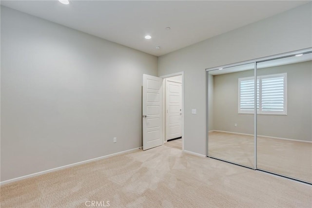 13139 Upland Ct, Hesperia, CA 92344 - unfurnished bedroom featuring light carpet, a closet, baseboards, and recessed lighting