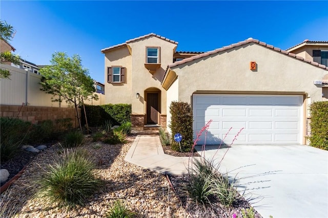 13139 Upland Ct, Hesperia, CA 92344 - mediterranean / spanish home with an attached garage, stucco siding, concrete driveway, and a tile roof