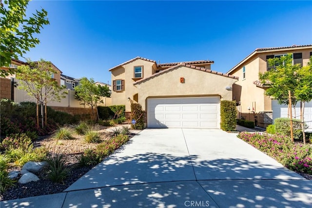 13139 Upland Ct, Hesperia, CA 92344 - view of front facade with stucco siding, driveway, a tile roof, and an attached garage