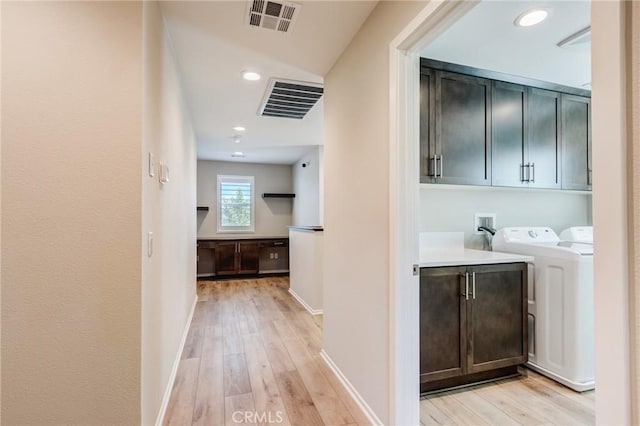 13139 Upland Ct, Hesperia, CA 92344 - hallway featuring light wood-style flooring, baseboards, separate washer and dryer, and recessed lighting