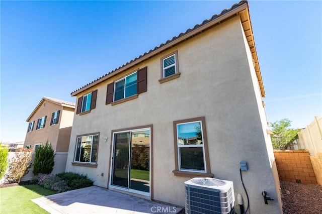 13139 Upland Ct, Hesperia, CA 92344 - rear view of house with central air condition unit, a patio area, and stucco siding