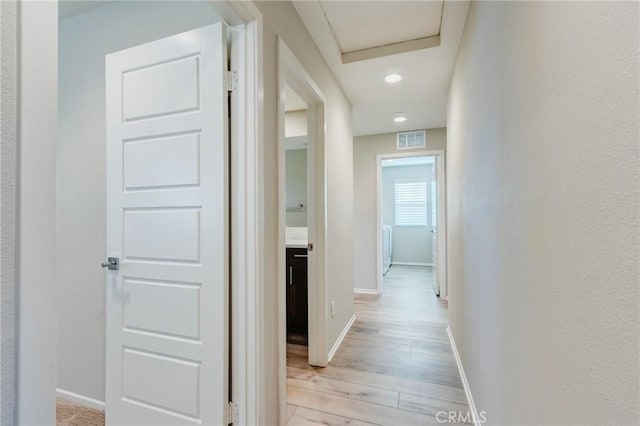 13139 Upland Ct, Hesperia, CA 92344 - hallway with light wood-style floors, baseboards, and recessed lighting