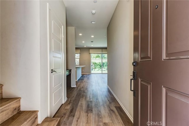 13139 Upland Ct, Hesperia, CA 92344 - corridor featuring wood finished floors, stairs, recessed lighting, and baseboards