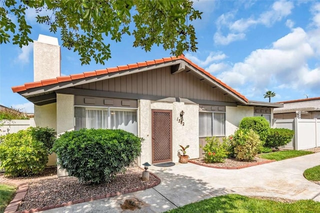1582 Lisa Ln, Redlands, CA 92374 - view of front of property with a tiled roof and stucco siding