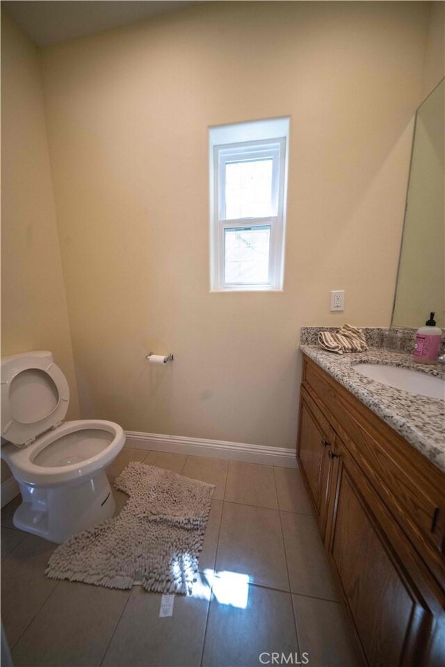 1630 Bridgeport Dr, Los Angeles, CA 90065 - bathroom featuring toilet, vanity, tile patterned floors, and baseboards