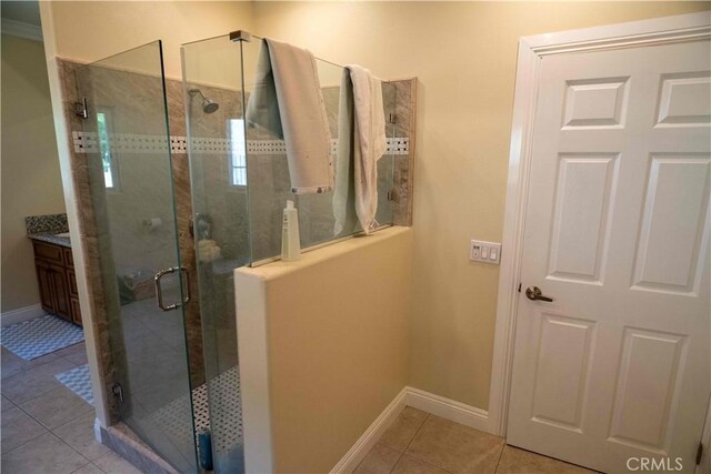 1630 Bridgeport Dr, Los Angeles, CA 90065 - bathroom with tile patterned flooring, a shower stall, baseboards, and vanity