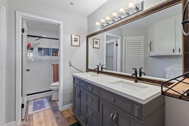 236 S Grisly Canyon Dr Unit N, Orange, CA 92869 - full bath featuring toilet, wood finished floors, double vanity, and a stall shower