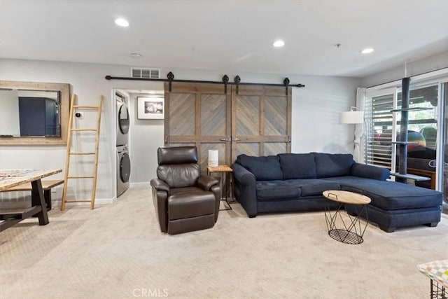 236 S Grisly Canyon Dr Unit N, Orange, CA 92869 - living area with stacked washer / drying machine, carpet, recessed lighting, baseboards, and a barn door