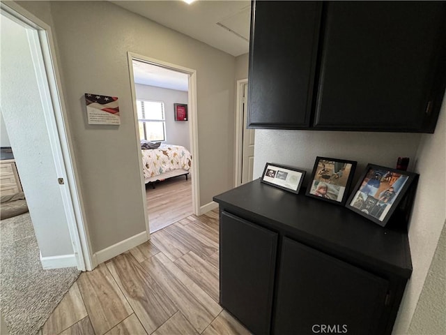 479 Stanford Dr, Barstow, CA 92311 - hallway with baseboards and light wood-style flooring