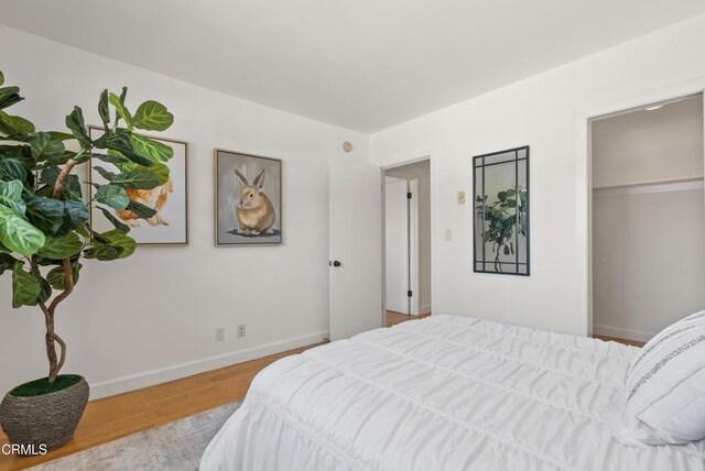 7560 Hollywood Blvd Unit 409, Los Angeles, CA 90046 - bedroom with wood finished floors and baseboards