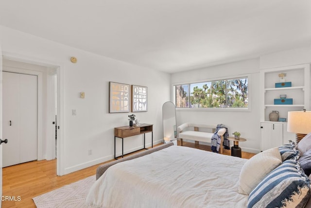7560 Hollywood Blvd Unit 409, Los Angeles, CA 90046 - bedroom featuring light wood-style floors and baseboards