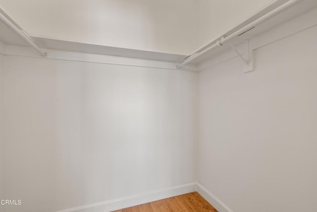 7560 Hollywood Blvd Unit 409, Los Angeles, CA 90046 - walk in closet with light wood-style floors