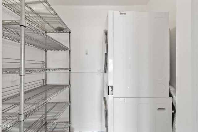 7560 Hollywood Blvd Unit 409, Los Angeles, CA 90046 - pantry featuring stacked washer / dryer