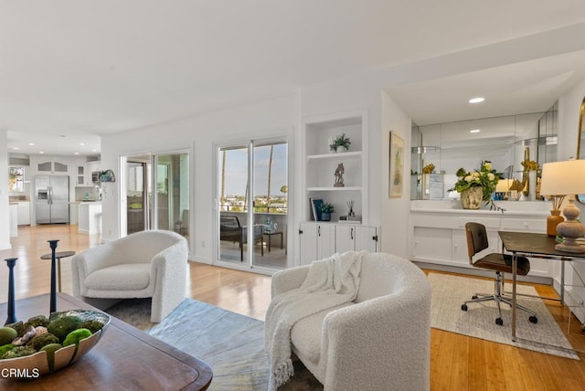7560 Hollywood Blvd Unit 409, Los Angeles, CA 90046 - living room featuring light wood-style flooring, an office area, built in features, and recessed lighting