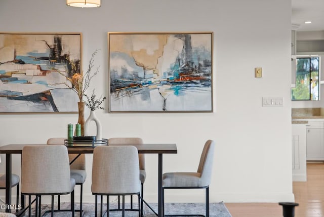 7560 Hollywood Blvd Unit 409, Los Angeles, CA 90046 - dining space featuring wood finished floors and baseboards