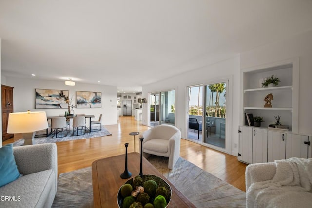 7560 Hollywood Blvd Unit 409, Los Angeles, CA 90046 - living area featuring light wood-type flooring, built in features, and recessed lighting