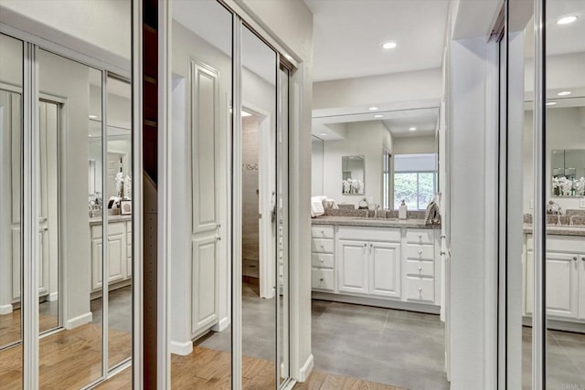4523 Cordoba Way, Oceanside, CA 92056 - full bath with vanity, wood finished floors, recessed lighting, and a closet