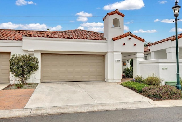 4523 Cordoba Way, Oceanside, CA 92056 - mediterranean / spanish home with a tiled roof, concrete driveway, a garage, and stucco siding