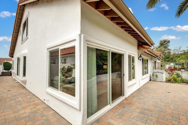 4523 Cordoba Way, Oceanside, CA 92056 - view of home's exterior featuring stucco siding and a patio area