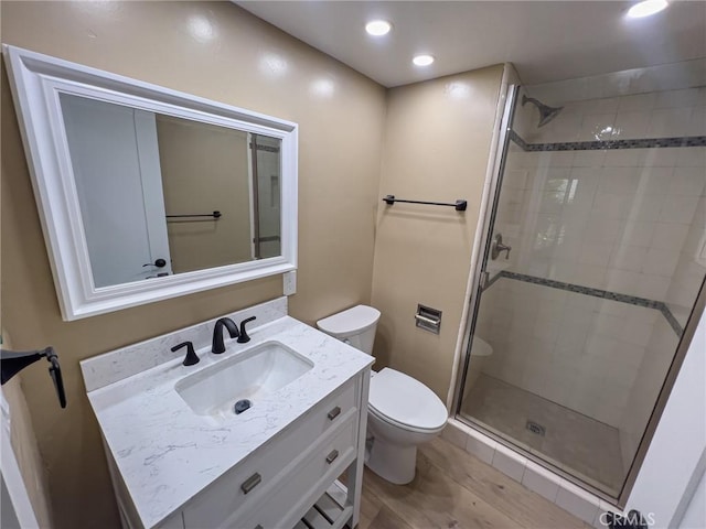 881 Peach St Unit A, San Luis Obispo, CA 93401 - bathroom with toilet, a stall shower, vanity, wood finished floors, and recessed lighting
