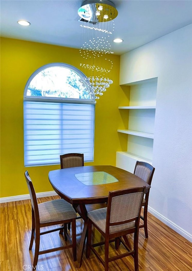11259 Corsica Ct, Rancho Cucamonga, CA 91730 - dining space featuring a chandelier, wood finished floors, and recessed lighting